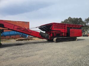 Red Hammel 950 shredder on tracks with discharge conveyor