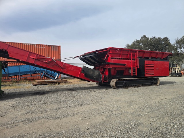 Red Hammel 950 shredder on tracks with discharge conveyor