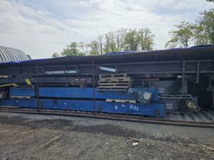Universal Industries modular conveyors in a container, side view