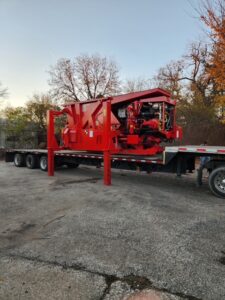 Bonfiglioli Squalo 1000 mobile shear loaded on a flatbed trailer