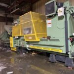 Bollegraaf HBC 120 baler with yellow guard in a warehouse