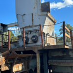 SSI Model 6000 slow speed shredder on its stand