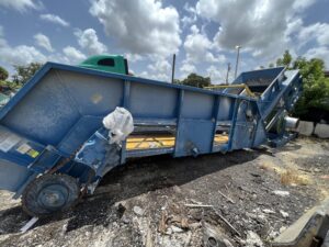 2005 Hustler 60 inch steel belt in-feed conveyor, side view