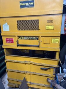 Yellow Harmony single phase vertical baler, front view