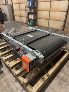 New 24 inch crossbelt magnet with cleated belt on a pallet