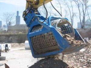Okada trommel bucket on an excavator screening debris