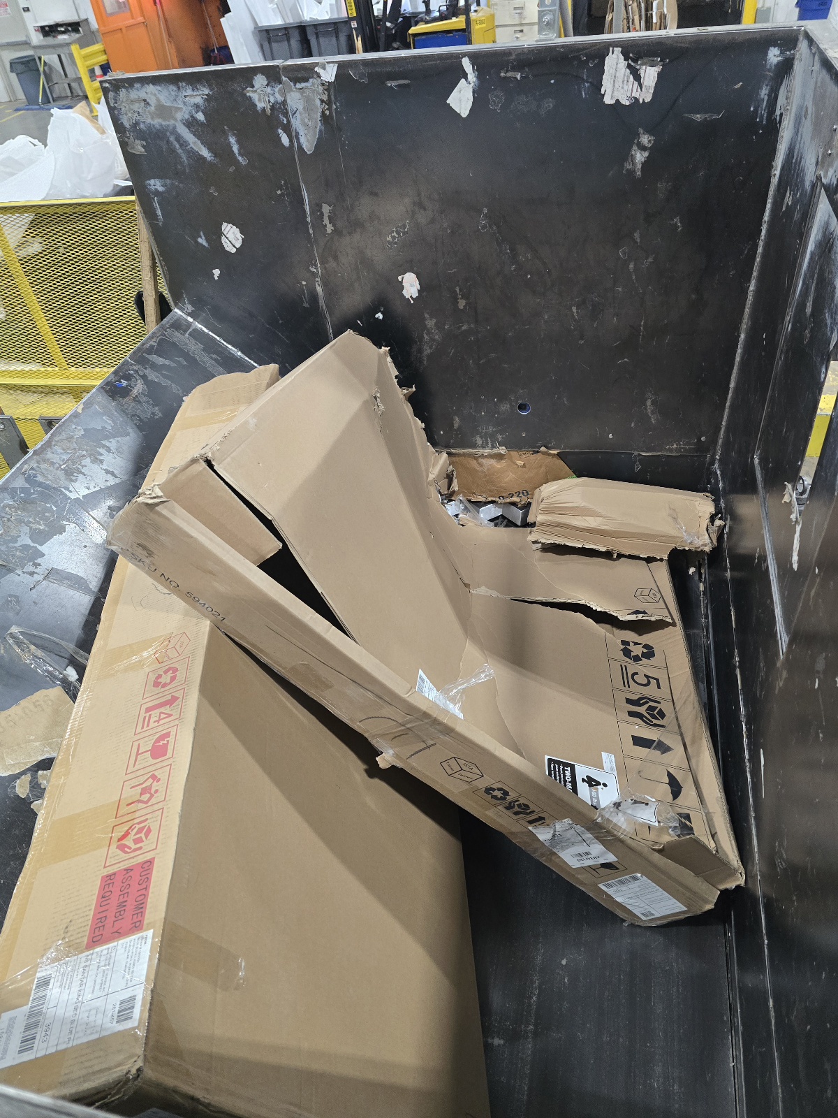 Feed hopper loaded with cardboard
